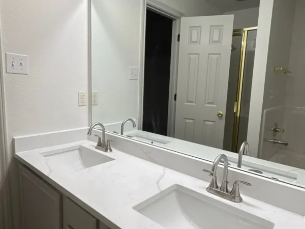 After: painted double vanity with a new countertop in Lancaster, TX