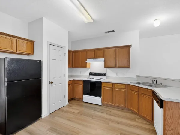 Before: kitchen with original oak cabinets in Lancaster, TX