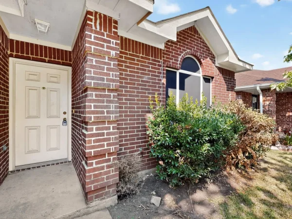 Before: front entry and eaves in Lancaster, TX
