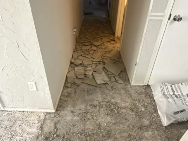 During construction: old tile floor removed in the hallway in Carrollton, TX