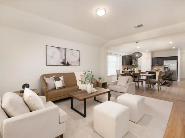 After: open living and dining area with continuous new flooring in Keller, TX