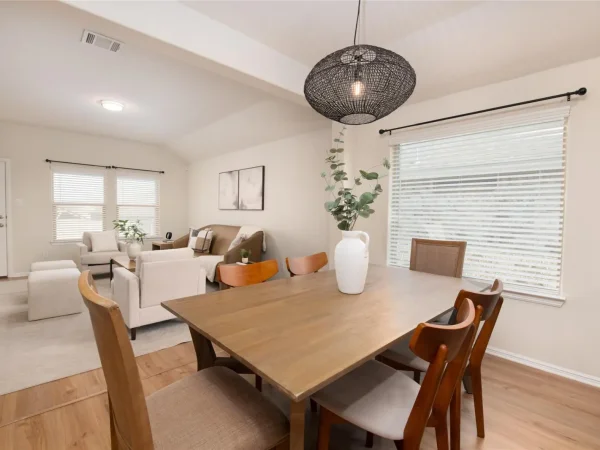 After: dining area with new flooring and pendant light in Keller, TX