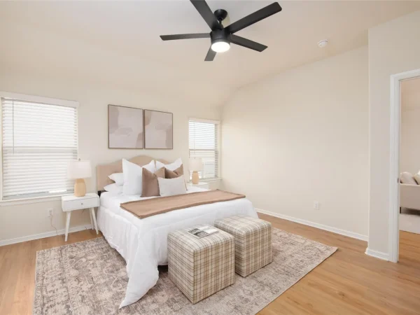 After: bedroom with new flooring and ceiling fan in Keller, TX
