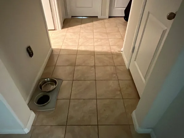 Before: hallway with beige tile floor in Keller, TX