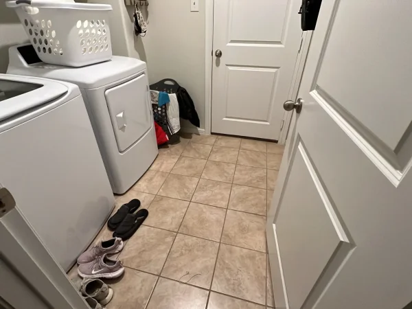 Before: laundry room with tile floor in Keller, TX