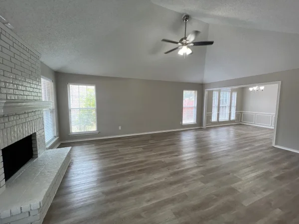 After: room repainted in light gray with white trim in Dallas, TX