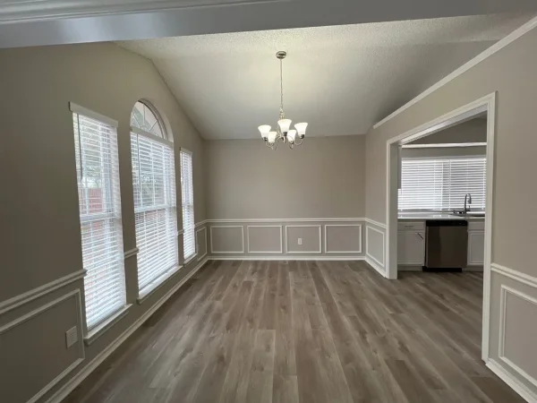 After: dining area repainted in light gray with white trim in Dallas, TX