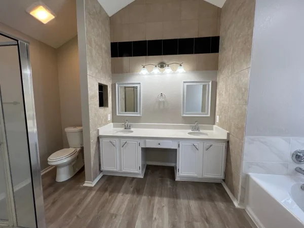 After: primary bathroom repainted in a light neutral color in Dallas, TX