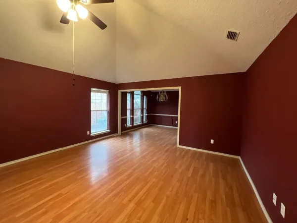 Before: room with dark red walls in Dallas, TX