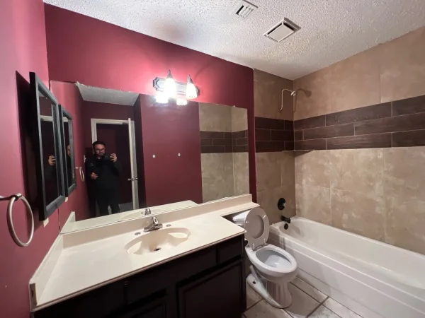 Before: bathroom with dark red walls in Dallas, TX