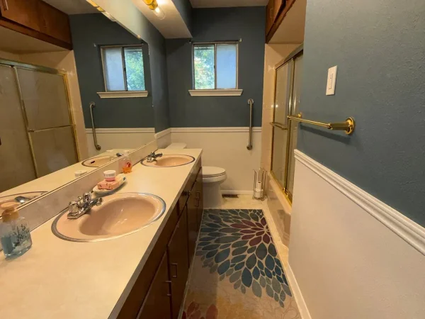After: bathroom with two-tone walls, chair rail and new light fixtures in Dallas, TX