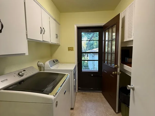 After: laundry room with painted walls, ceiling and cabinets in Dallas, TX