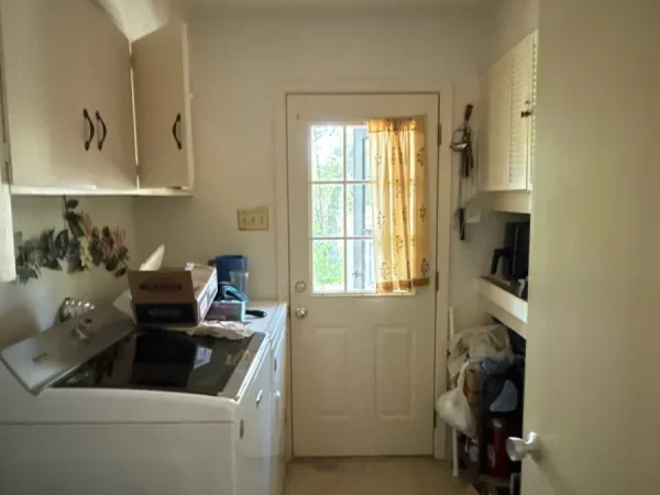 Before: laundry room before painting in Dallas, TX