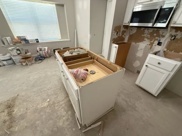 During construction: demolition of the old builder-grade kitchen cabinets in Dallas, TX