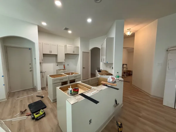 During construction: kitchen island and peninsula ready for countertops in Dallas, TX