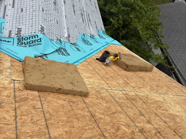 During construction: GAF StormGuard leak barrier and FeltBuster underlayment over new decking in Dallas, TX