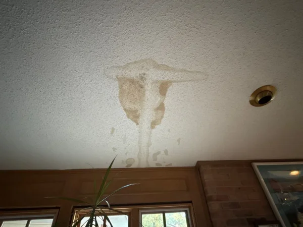 Before: living room ceiling stained by an active roof leak in Denton, TX