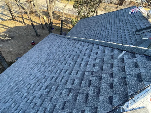 During construction: GAF charcoal architectural shingles going on in Denton, TX
