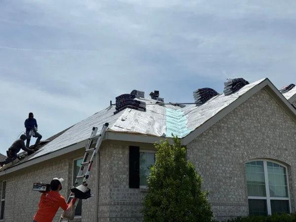 During construction: crew tearing off the old roof in Melissa, TX