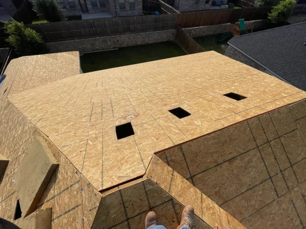 During construction: roof decking exposed after tear-off in Melissa, TX