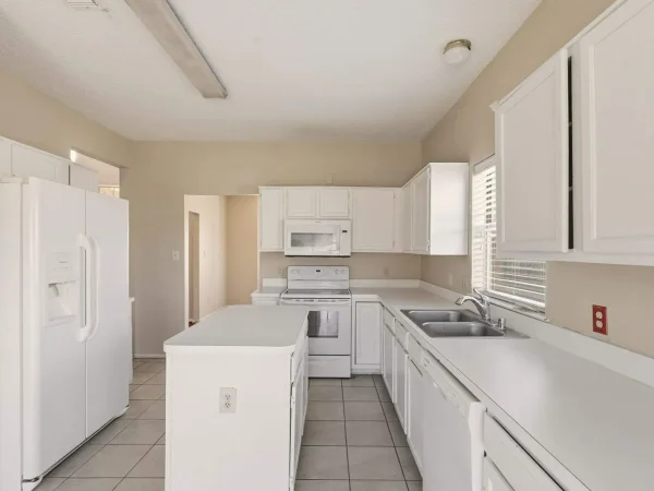 Before: dated kitchen in DeSoto, TX