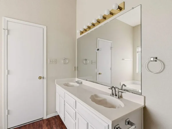 Before: primary bathroom vanity in DeSoto, TX