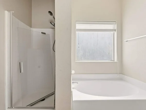 Before: primary bathroom tub and shower in DeSoto, TX
