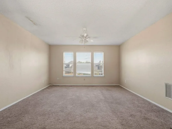 Before: bedroom with old carpet in DeSoto, TX