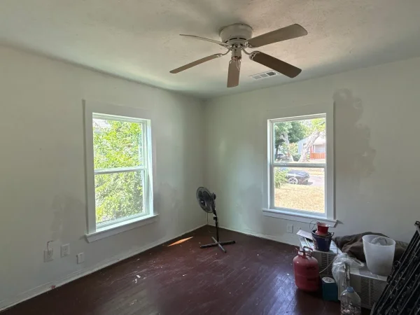 After: second bedroom with new vinyl single-hung windows and trim in Dallas, TX