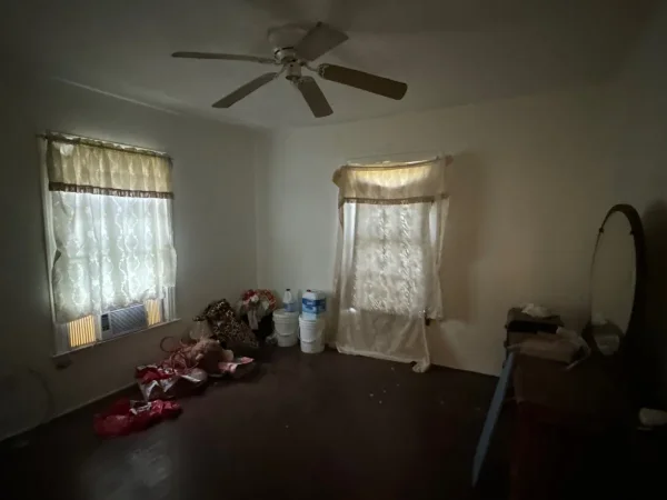 Before: second bedroom with old windows in Dallas, TX