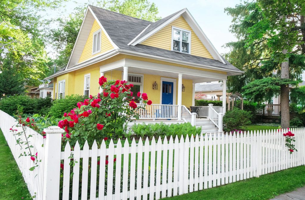 picture of home with picket fence